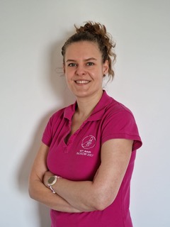 Brunette woman in red colour medical workwear
